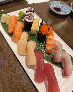Assorted nigiri and maki on a wooden table