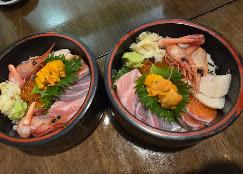 Two bowls of chirashi don with fresh sashimi